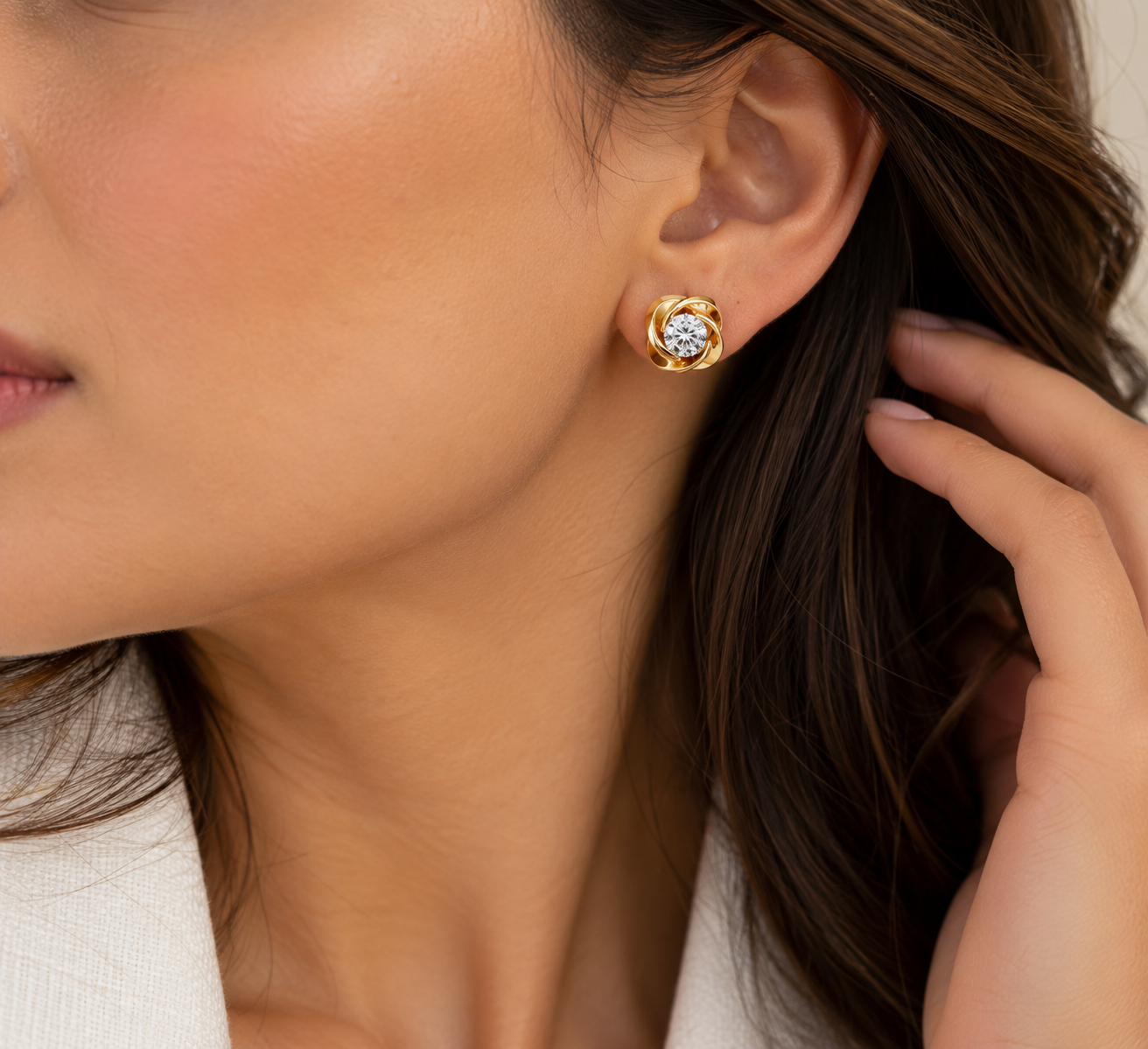 Pair of diamond stud earrings in gold settings